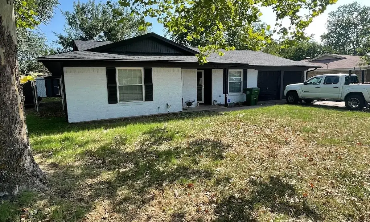 Professional roofing crew working on a residential roof in Destrehan